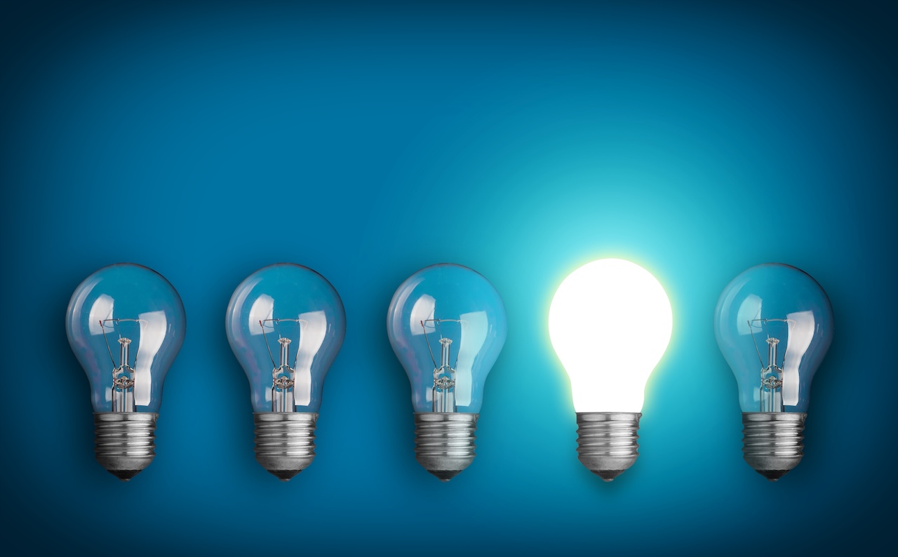row of light bulbs and glowing bulb